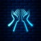 Glowing neon Hands icon isolated on brick wall background