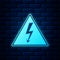 Glowing neon High voltage sign icon isolated on brick wall background. Danger symbol. Arrow in triangle. Warning icon