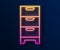 Glowing neon line Chest of drawers icon isolated on black background. Vector