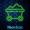 Glowing neon line Coal mine trolley icon isolated on brick wall background. Factory coal mine trolley. Vector