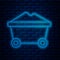 Glowing neon line Coal mine trolley icon isolated on brick wall background. Factory coal mine trolley. Vector