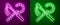 Glowing neon line Crook and flail icon isolated on purple and green background. Ancient Egypt symbol. Scepters of egypt