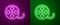 Glowing neon line Film reel icon isolated on purple and green background. Vector