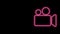 Glowing neon line Movie or Video camera icon isolated on black background. Cinema camera icon. 4K Video motion graphic