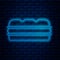 Glowing neon line Sandwich icon isolated on brick wall background. Hamburger icon. Burger food symbol. Cheeseburger sign