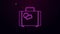 Glowing neon line Suitcase for travel icon isolated on purple background. Traveling baggage sign. Travel luggage icon