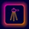 Glowing neon line Tripod icon isolated on black background. Colorful outline concept. Vector