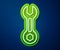 Glowing neon line Wrench spanner icon isolated on blue background. Vector