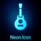 Glowing neon Mexican guitar icon isolated on brick wall background. Acoustic guitar. String musical instrument. Vector