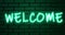 Glowing neon multicolor sign Welcome on a brick wall background