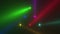 Glowing neon rainbow spotlight rays on disco stage