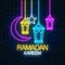 Glowing neon ramadan holy month sign on dark brick wall background. Ramadan greeting card with greeting text