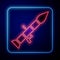 Glowing neon Rocket launcher with missile icon isolated on blue background. Vector