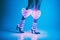 Glowing neon shaped hearts lights with slender model legs and shoes - generative AI