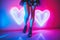 Glowing neon shaped hearts lights with slender model legs and shoes - generative AI