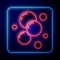 Glowing neon Soap water bubbles icon isolated on blue background. Vector
