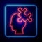 Glowing neon Solution to the problem in psychology icon isolated on blue background. Puzzle. Therapy for mental health