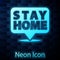 Glowing neon Stay home icon isolated on brick wall background. Corona virus 2019-nCoV. Vector.