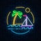 Glowing neon summer sign with sailing ship and island with palm in ocean in round frames on dark brick wall background.