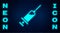Glowing neon Syringe with serum icon isolated on brick wall background. Syringe for vaccine, vaccination, injection, flu