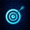 Glowing neon Target with arrow icon isolated on brick wall background. Dart board sign. Archery board icon. Dartboard