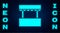 Glowing neon Ticket box office icon isolated on brick wall background. Ticket booth for the sale of tickets for