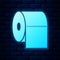 Glowing neon Toilet paper roll icon isolated on brick wall background. Vector