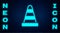 Glowing neon Traffic cone icon isolated on brick wall background. Vector