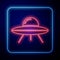 Glowing neon UFO flying spaceship icon isolated on blue background. Flying saucer. Alien space ship. Futuristic unknown