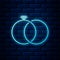 Glowing neon Wedding rings icon isolated on brick wall background. Bride and groom jewelery sign. Marriage icon. Diamond