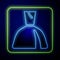 Glowing neon Woman dress icon isolated on blue background. Clothes sign. Vector