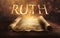Glowing open scroll parchment revealing the book of the Bible. Book of Ruth