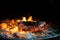 Glowing orange burning embers in a chiminea fire