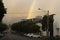 Glowing Rainbow Over Inner City Suburban Area