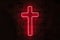 Glowing red neon cross hangs on the wall behind the bars in the dark