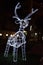 Glowing reindeer made of wire and light bulbs