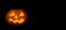 Glowing scary Halloween Pumpkin lantern on black background. Free space for your text