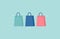 Glowing shopping bags on a green turquoise background. Flat vector illustration