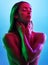 Glowing skincare, hands or touch in neon lighting on isolated blue background with neck, body or skin. Beauty, model or