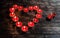Glowing small red candles arranged in heart shape