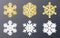 Glowing snowflakes. Gold and silver snowflake collection. Shining Christmas decoration. Bright festive symbols. Elegant