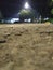 glowing stone at night with a beautiful industrial background with sharp focus