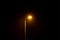 glowing street lamp at rainy night