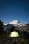 Glowing tent at night beneath Mount Baker, Washington state