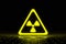 Glowing triangle sign of radioactive threat. Chemical industry