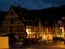 Glowing warm homely windows in a small Alsatian village. Comfort and warmth at home on a winter evening