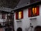 Glowing warm homely windows in a small Alsatian village. Comfort and warmth at home on a winter evening