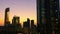 Glowing windows of skyscrapers at sunset - View of modern offices and towers, Abu Dhabi