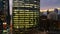 Glowing windows of skyscrapers at sunset - View of modern offices and towers, Abu Dhabi