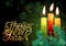 Glowing xmas candles with melted wax and christmas tree on dark green bokeh background. Lettering Happy New Year.